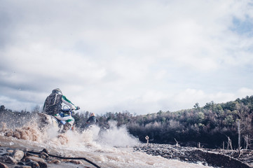 Fototapeta na wymiar Motocross accelerating speed in mud