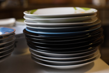Stack of odd plates in kitchen