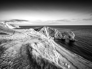 Sunset over Durdle Door - the most famous landmark in Devon England