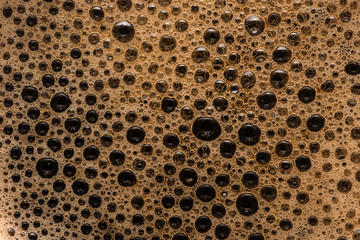 Coffee foam extreme close-up texture background