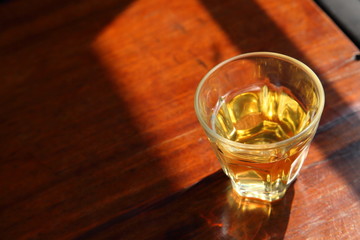 Chinese hot tea with morning light on rustic wooden table