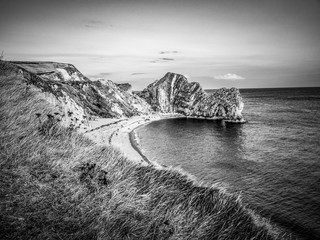 Sunset over Durdle Door - the most famous landmark in Devon England