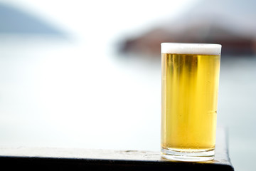 Fresh of beer in long glass with nature background