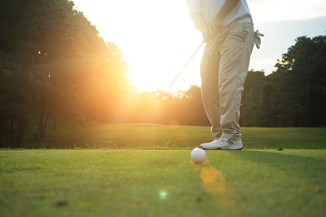 Blurred golfers are putting golf in the evening golf course golf backglound in Thailand