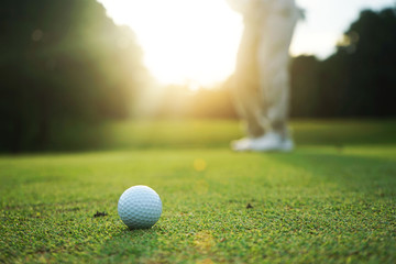 Golfers are putting golf in the evening golf course golf backglound in Thailand