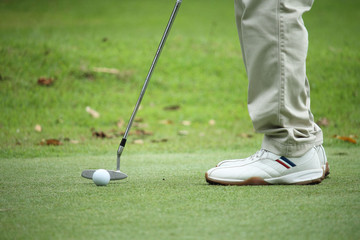 Fototapeta na wymiar Golfers are putting golf in the evening golf course golf backglound in Thailand