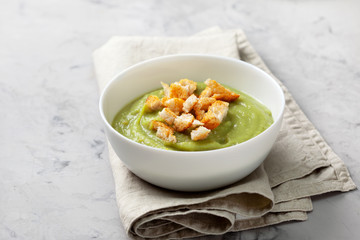 green soup with croutons