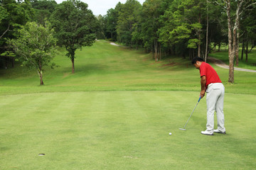Golfers are putting golf in the evening golf course golf backglound in Thailand