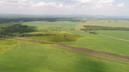 Fototapeta na wymiar panoramic picture of green valley, fields and forest made by dron from high flight