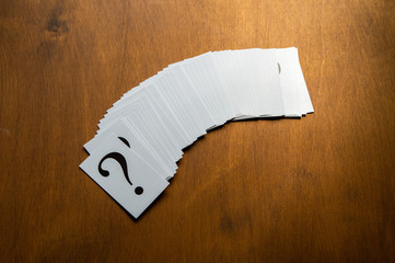 Question mark heap on table concept for confusion, question or solution