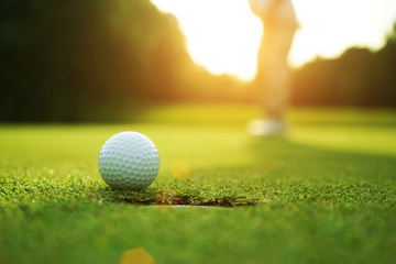 Golfers are putting golf in the evening golf course golf backglound in Thailand