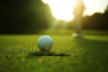 Golfers are putting golf in the evening golf course golf backglound in Thailand