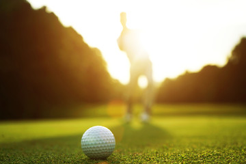 Golfers are putting golf in the evening golf course golf backglound in Thailand