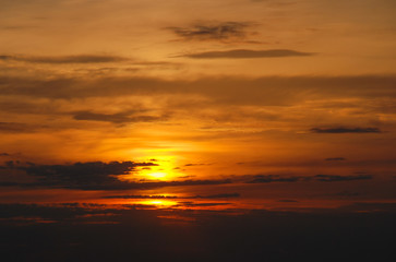 Naklejka na ściany i meble Beautiful sunset with a sun and clouds 