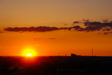 Beautiful sunset with a sun and clouds 