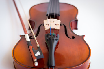 Fototapeta premium Violin in white background with bow
