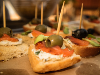 Mediterranean canape with olives and tomato