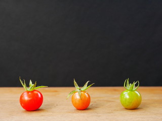 fresh cherry tomatoes on wooden table