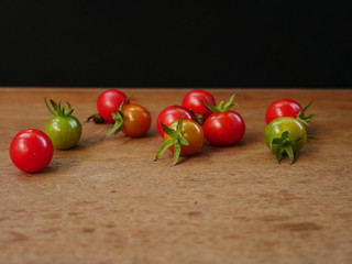 cherry tomatoes on wooden table
