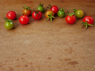 cherry tomatoes on wooden table