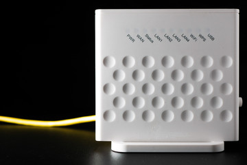 White WiFi router on black background