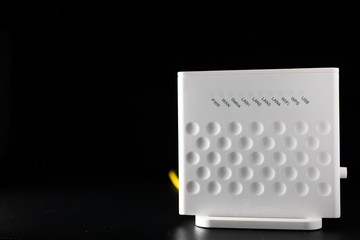 White WiFi router on black background