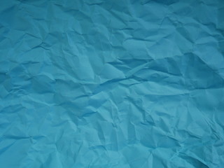 crumpled blue paper background