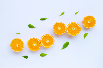High vitamin C. Fresh orange citrus fruit with leaves isolated on white.