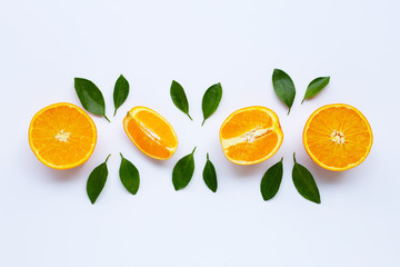 High vitamin C. Fresh orange citrus fruit with leaves isolated on white .