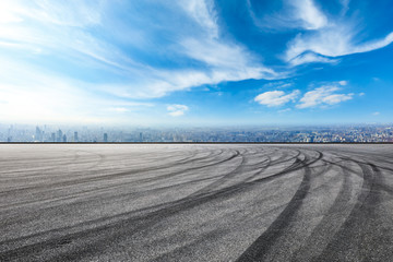 Naklejka premium Empty asphalt road and city skyline in Shanghai,high angle view