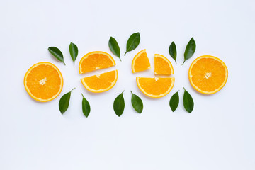High vitamin C. Fresh orange citrus fruit with leaves isolated on white.