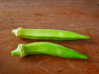 fresh okra on wood background,organic vegetable food