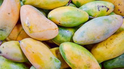 Group of yellow green fresh ripe mango pattern, copy space, top view