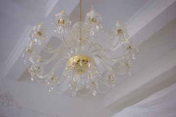  large chandelier on the ceiling in the luxury interior