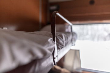 Bed in a train in a compartment - obrazy, fototapety, plakaty