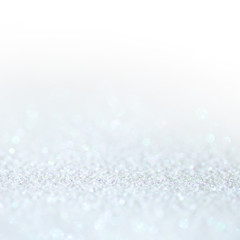 White light glitter magic background. Defocused light and free focused place for your design.