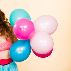 Fototapeta na wymiar Female holding colorful balloons.