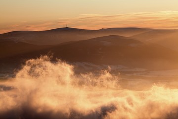 Obraz premium Fantastic winter landscape in snowy mountains. Inversion weather. Christmas holiday concept. Praded, Jeseniky mountains, Czech republic, Europe. Beautiful panorama