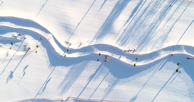 Aerial view of skiers and chairlift over ski slopes