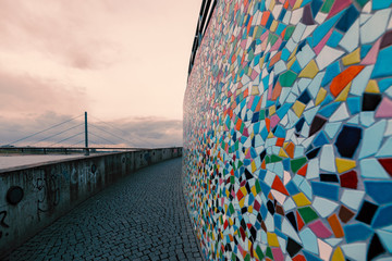 Duesseldorf, GERMANY - February 09, 2019: Colorful wall mosaik contrasts with dull grey winter light