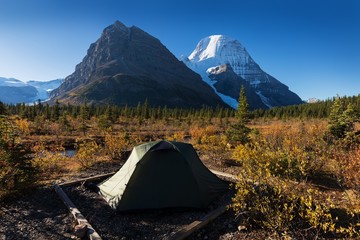 Tent in camp before Panoramic Landscape Snowy Mountain Robson Park Canadian Rocky Mountains. Majestic Mount Robson Provincial Park British Columbia Canada