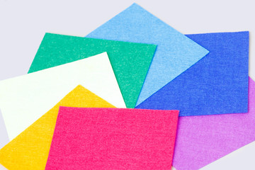 a set of colored sheets of felt, rainbow colors