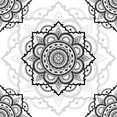 Seamless decorative ornament in ethnic oriental style. Circular pattern in form of mandala for Henna, Mehndi, tattoo, decoration.