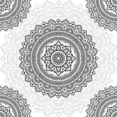 Seamless decorative ornament in ethnic oriental style. Circular pattern in form of mandala for Henna, Mehndi, tattoo, decoration.