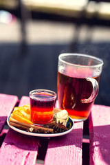 Delicious tea with spices and raspberry juice. Shallow depth of field.