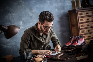 stylish guy developing accessories design. close up photo