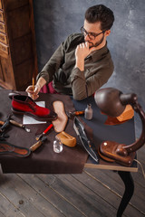 sleepy guy developing a construction, top angle view