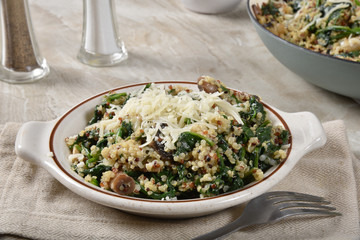 Hot spinach quinoa salad with mushrooms