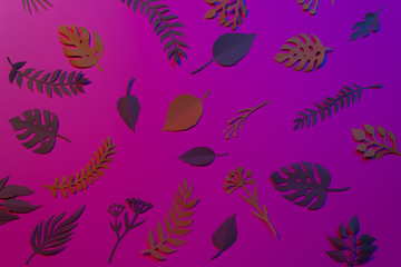 Tropical and palm leaves in vibrant bold gradient holographic colors. Concept art.