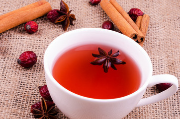 Beautiful cup of rosehip tea with anise